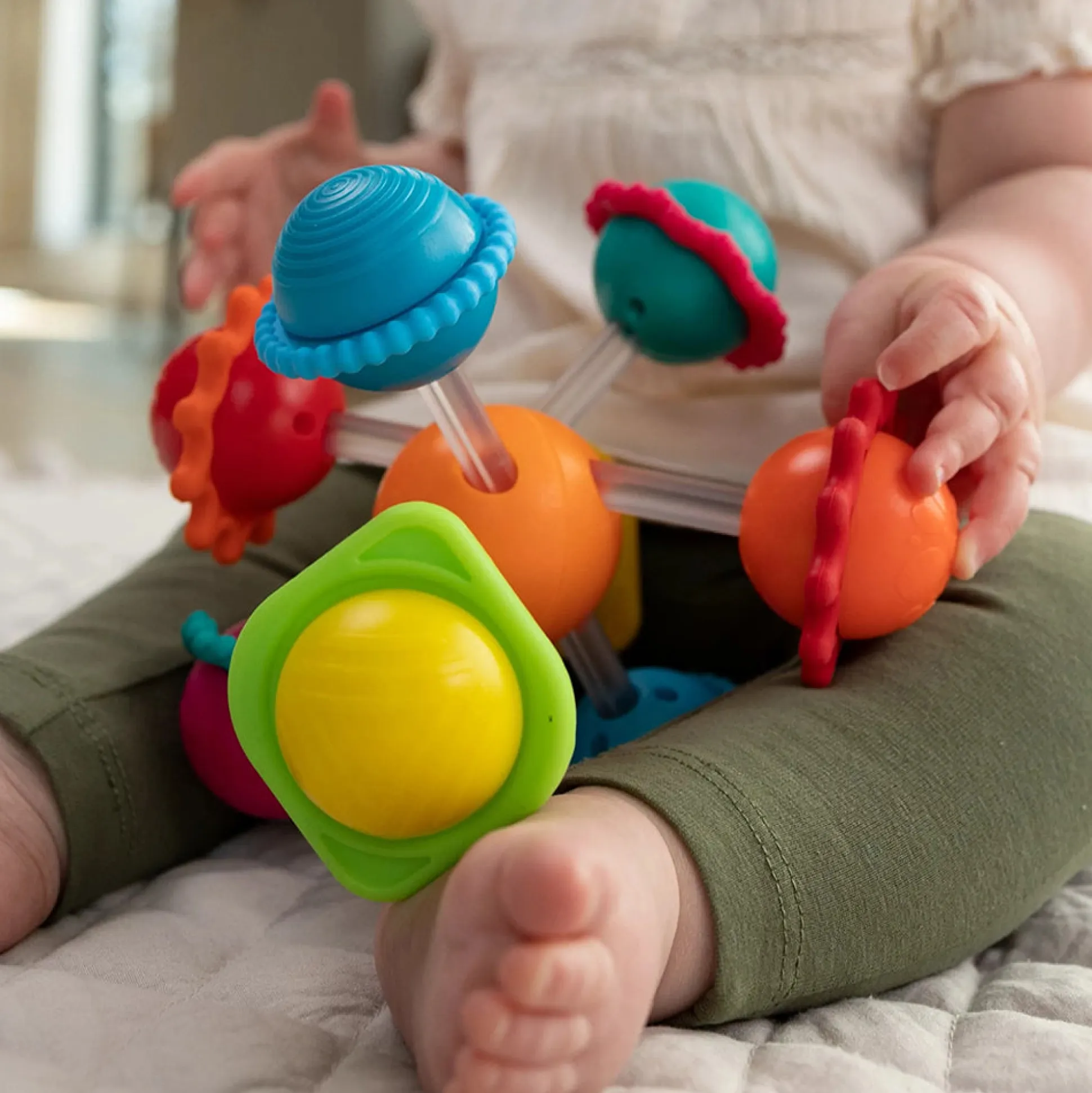 Wimzle Sensory Discovery Toy | Spinning Orbs & Silicone Rings