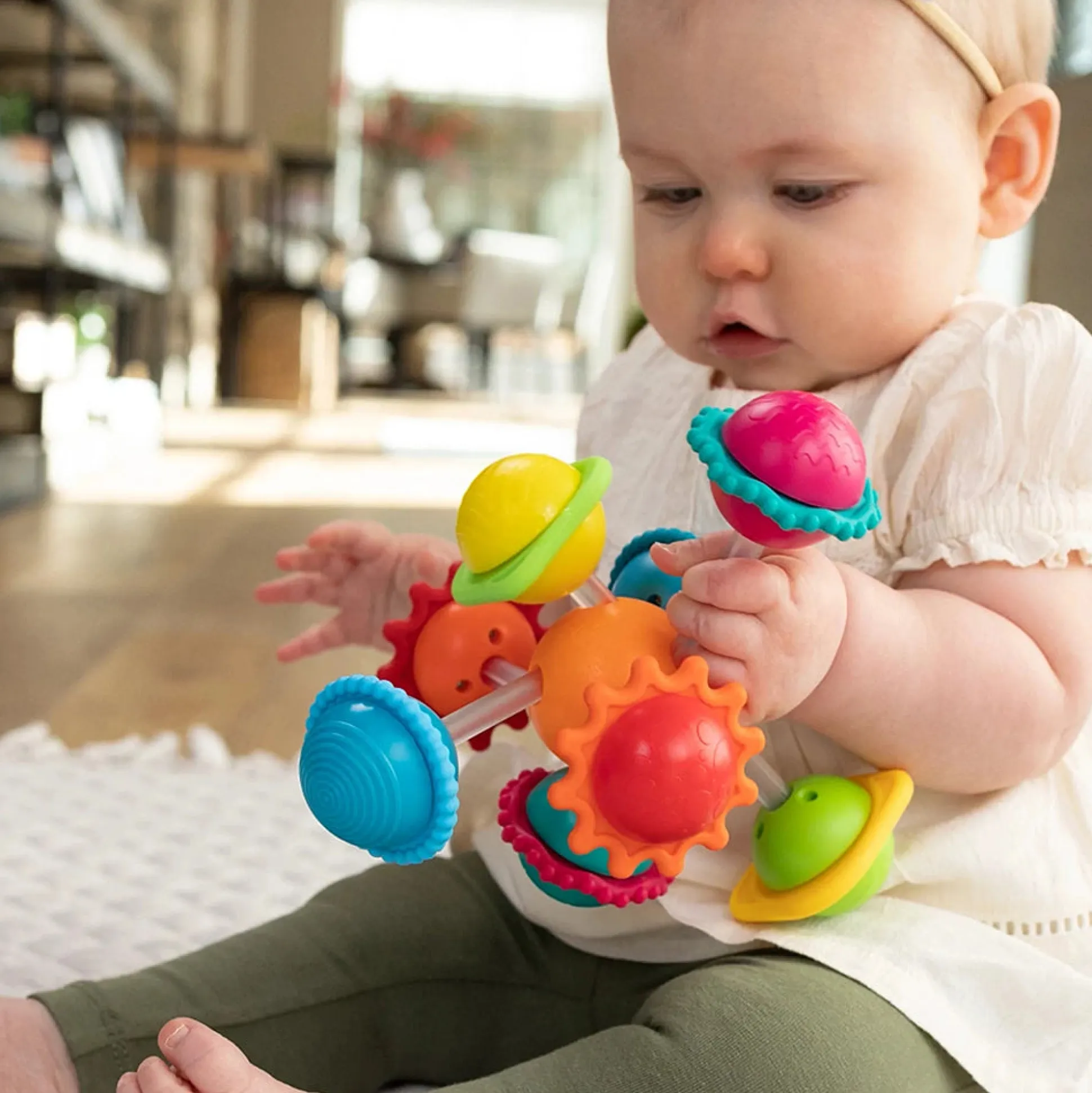 Wimzle Sensory Discovery Toy | Spinning Orbs & Silicone Rings