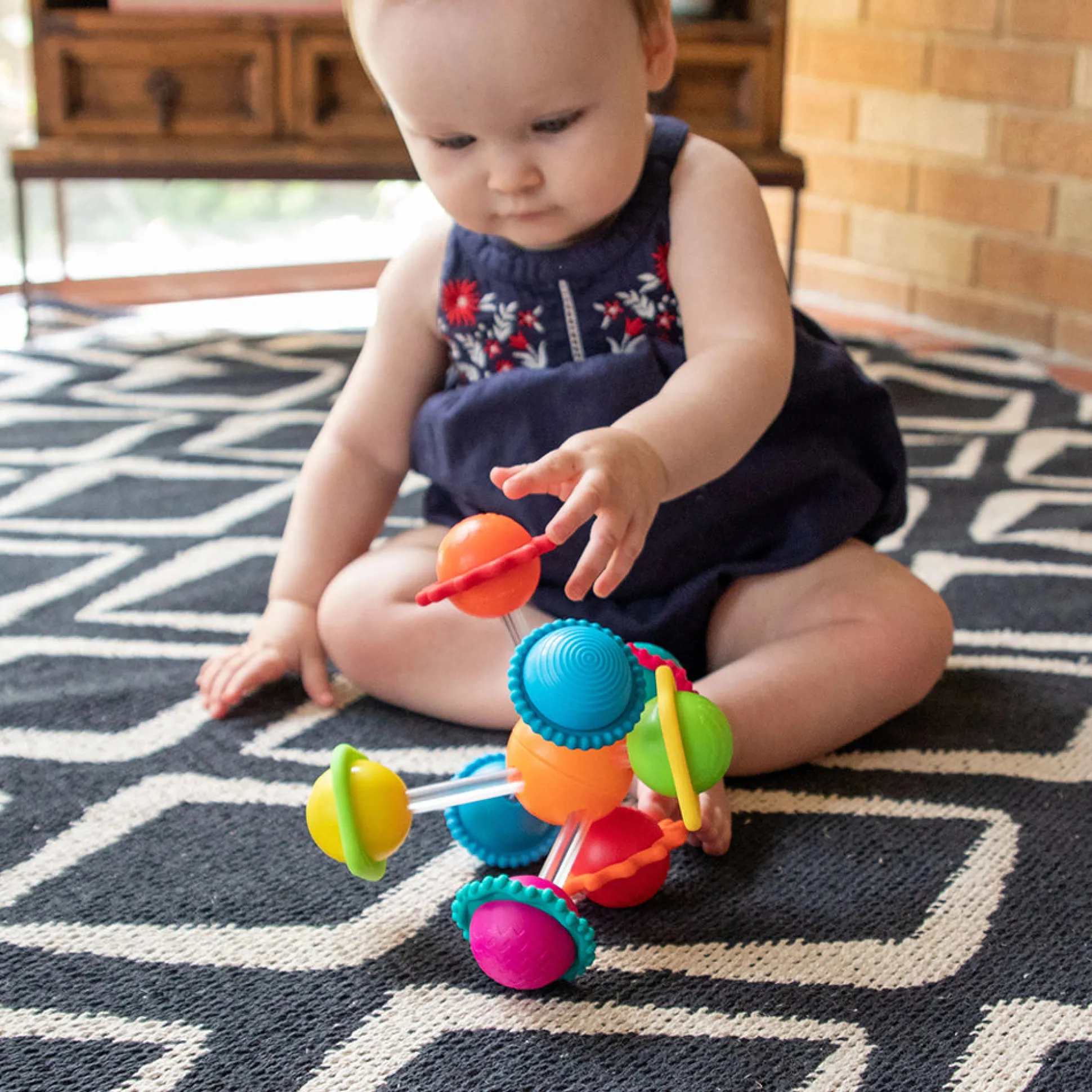 Wimzle Sensory Discovery Toy | Spinning Orbs & Silicone Rings
