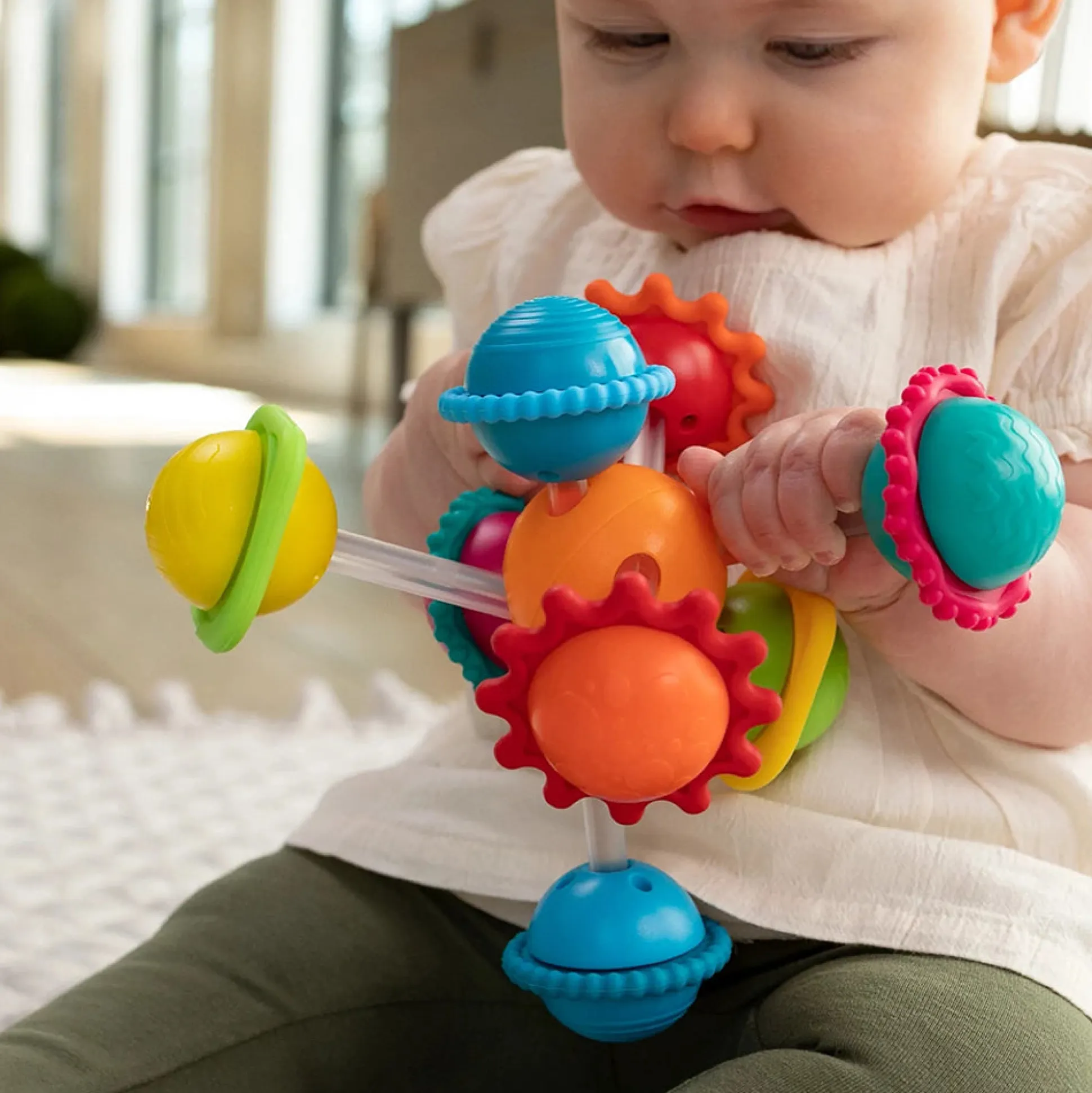 Wimzle Sensory Discovery Toy | Spinning Orbs & Silicone Rings